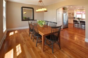 Dining room with wooden table and six wooden chairs